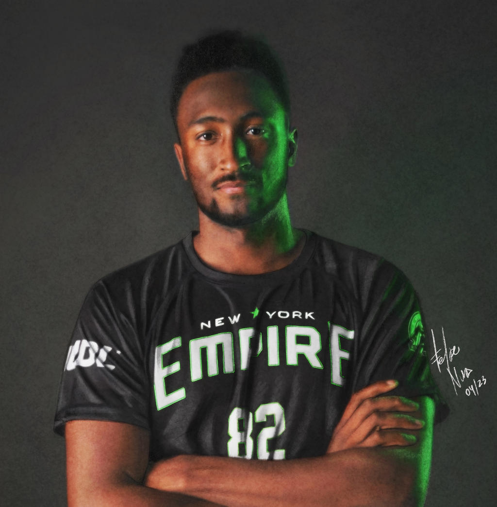 Portrait of Marques Brownlee, where in he's wearing a black jersey .